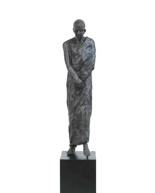 Tall Bronze Monk On Black Pedestal